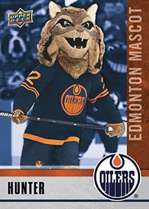 PHOTO: Kings mascot offers Oilers 'Hockey for Dummies' book during blowout